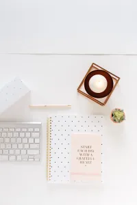 A keyboard and notebook's aerial view